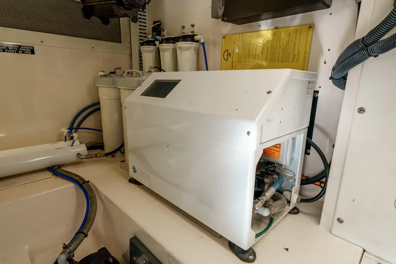 Dieguito Yacht Photos Pics Engine room of 2004 Cabo 48 Flybridge with mechanical equipment and wiring.