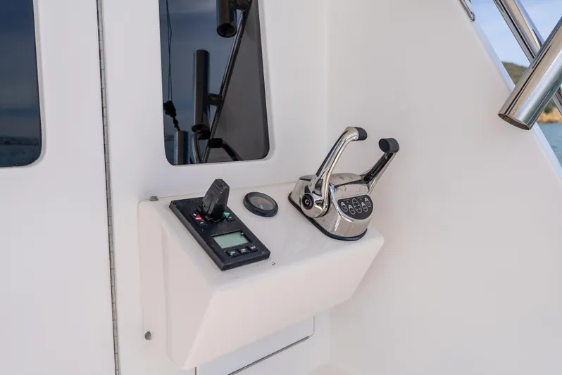 Dieguito Yacht Photos Pics Control panel of 2004 Cabo 48 Flybridge yacht with throttle and navigation instruments.