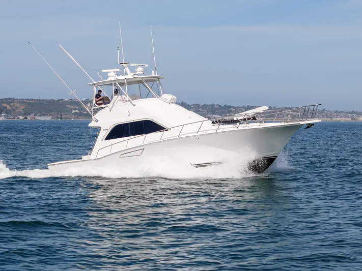 Dieguito Yacht Photos Pics 2004 Cabo 48 Flybridge yacht cruising on open water.