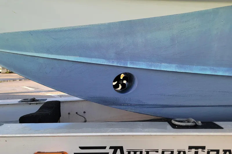  Yacht Photos Pics 2022 Yellowfin 42 Offshore boat hull on trailer, showcasing side view and propeller detail.