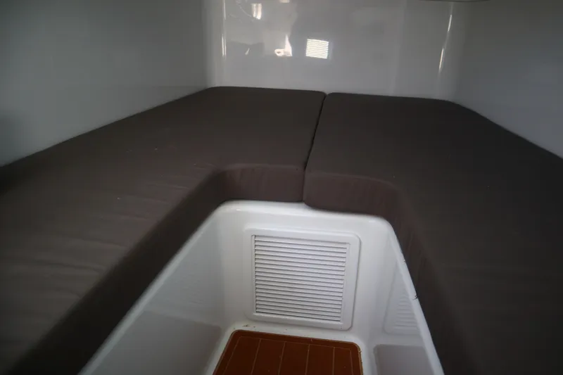  Yacht Photos Pics Interior cabin of 2022 Yellowfin 42 Offshore boat with cushioned seating.