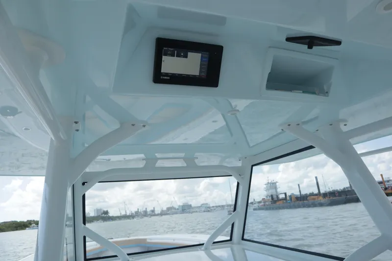  Yacht Photos Pics Interior view of 2022 Yellowfin 42 Offshore boat with electronic display and ocean backdrop.