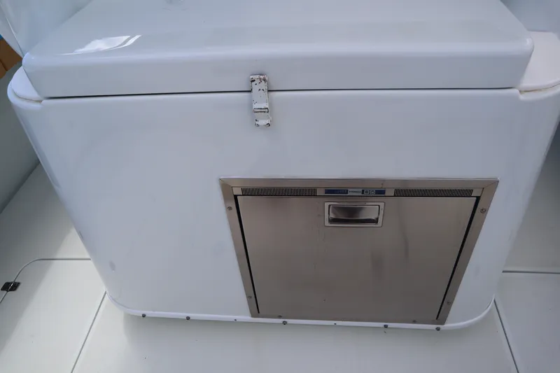  Yacht Photos Pics 2022 Yellowfin 42 Offshore boat interior with built-in stainless steel storage compartment.