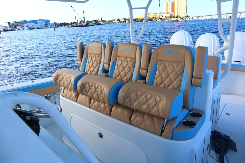  Yacht Photos Pics Luxurious seating on 2022 Yellowfin 42 Offshore boat with scenic waterfront view.