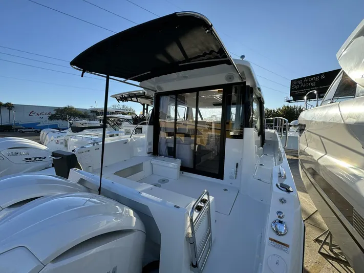  Yacht Photos Pics 2025 Jeanneau NC 1095 Weekender boat with sleek design and spacious deck.