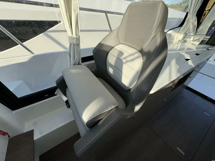  Yacht Photos Pics 2025 Jeanneau NC 1095 Weekender interior with modern seating and sleek design.