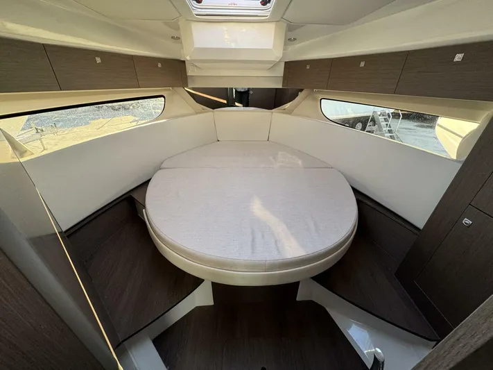  Yacht Photos Pics 2025 Jeanneau NC 1095 Weekender cabin with round bed and modern interior design.