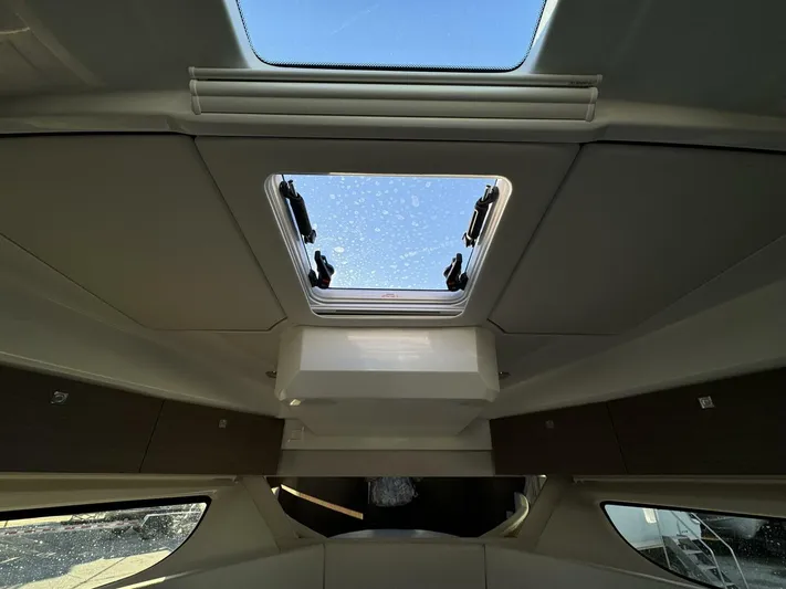  Yacht Photos Pics Interior view of 2025 Jeanneau NC 1095 Weekender with skylight and modern design.