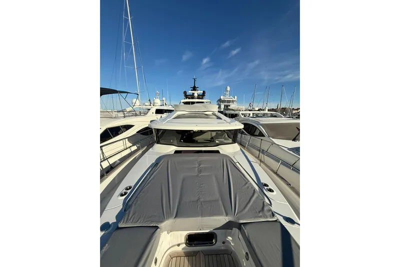 Gbtt Ex Lennartz Yacht Photos Pics Nimbus 495 Flybridge 2025 yacht docked at marina under clear blue sky.