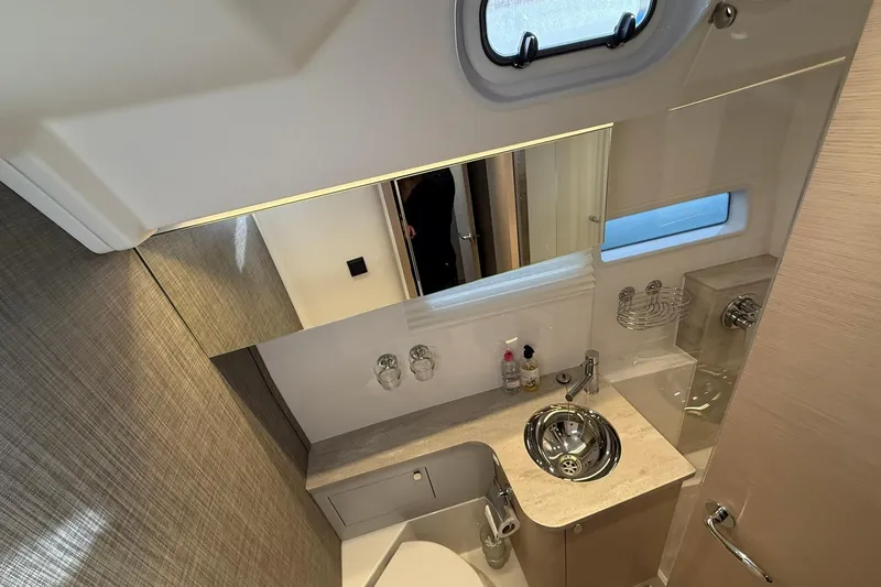 Gbtt Ex Lennartz Yacht Photos Pics Luxurious bathroom interior of 2025 Nimbus 495 Flybridge yacht, featuring modern fixtures and elegant design.