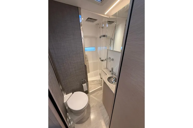 Gbtt Ex Lennartz Yacht Photos Pics Luxurious bathroom in 2025 Nimbus 495 Flybridge yacht with modern fixtures and elegant design.