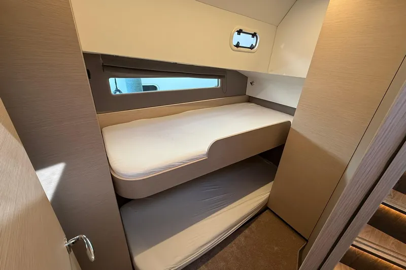 Gbtt Ex Lennartz Yacht Photos Pics 2025 Nimbus 495 Flybridge cabin with bunk beds and modern interior design.