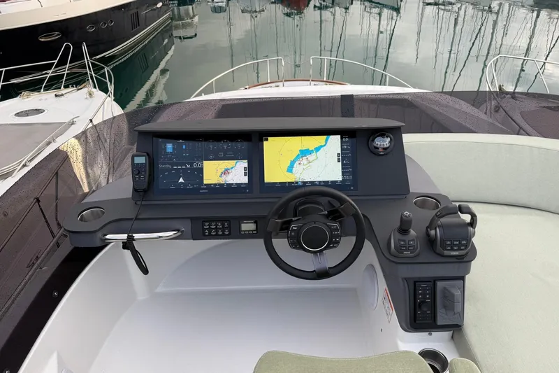 Gbtt Ex Lennartz Yacht Photos Pics 2025 Nimbus 495 Flybridge helm with advanced navigation displays and controls.