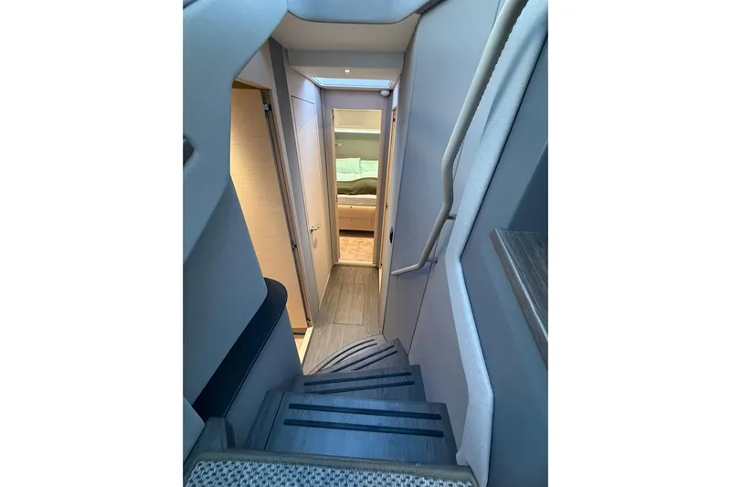 Gbtt Ex Lennartz Yacht Photos Pics Staircase leading to a cozy cabin interior on a 2025 Nimbus 495 Flybridge yacht.