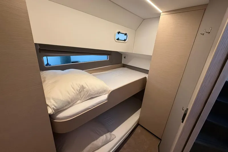 Gbtt Ex Lennartz Yacht Photos Pics 2025 Nimbus 495 Flybridge cabin with bunk beds and modern interior design.