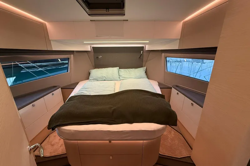 Gbtt Ex Lennartz Yacht Photos Pics Luxurious bedroom interior of 2025 Nimbus 495 Flybridge yacht with modern design.