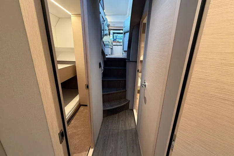 Gbtt Ex Lennartz Yacht Photos Pics Interior view of 2025 Nimbus 495 Flybridge yacht, featuring modern design and cozy cabins.
