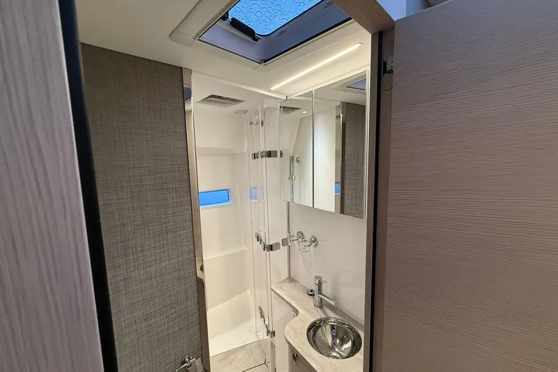 Gbtt Ex Lennartz Yacht Photos Pics Luxurious bathroom interior of 2025 Nimbus 495 Flybridge yacht with modern fixtures.