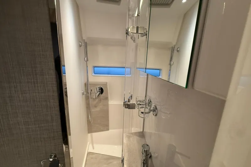 Gbtt Ex Lennartz Yacht Photos Pics Luxurious bathroom interior of 2025 Nimbus 495 Flybridge yacht, featuring modern fixtures and sleek design.