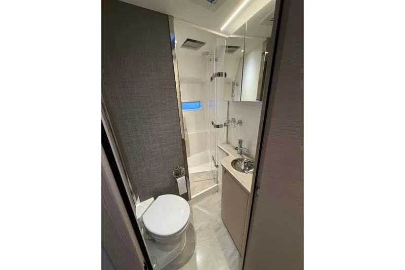 Gbtt Ex Lennartz Yacht Photos Pics Luxurious bathroom in 2025 Nimbus 495 Flybridge yacht, featuring modern fixtures and elegant design.