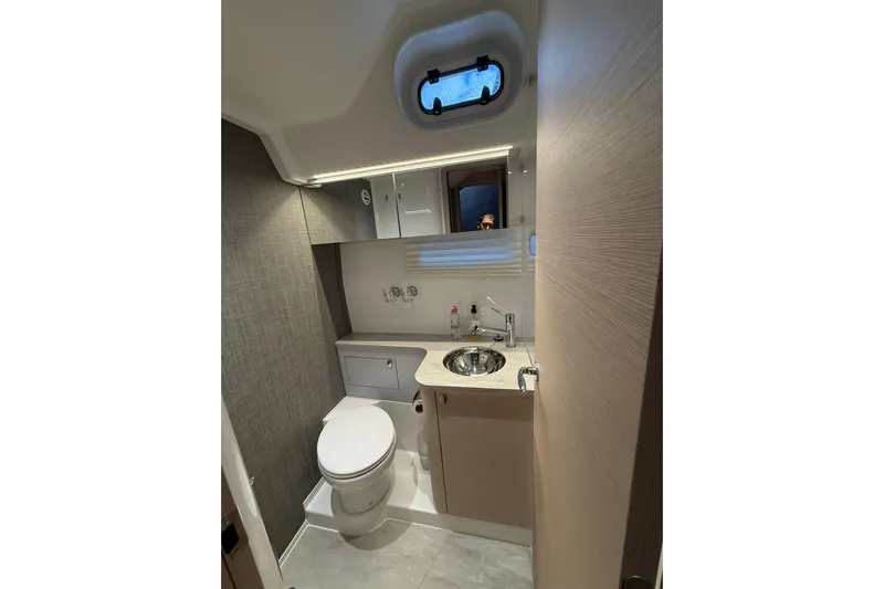 Gbtt Ex Lennartz Yacht Photos Pics Modern bathroom interior on 2025 Nimbus 495 Flybridge yacht, featuring sleek design and compact amenities.