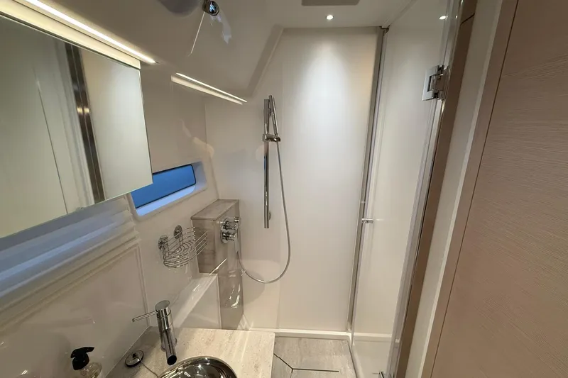 Gbtt Ex Lennartz Yacht Photos Pics Luxurious bathroom interior of 2025 Nimbus 495 Flybridge yacht, featuring modern fixtures and elegant design.