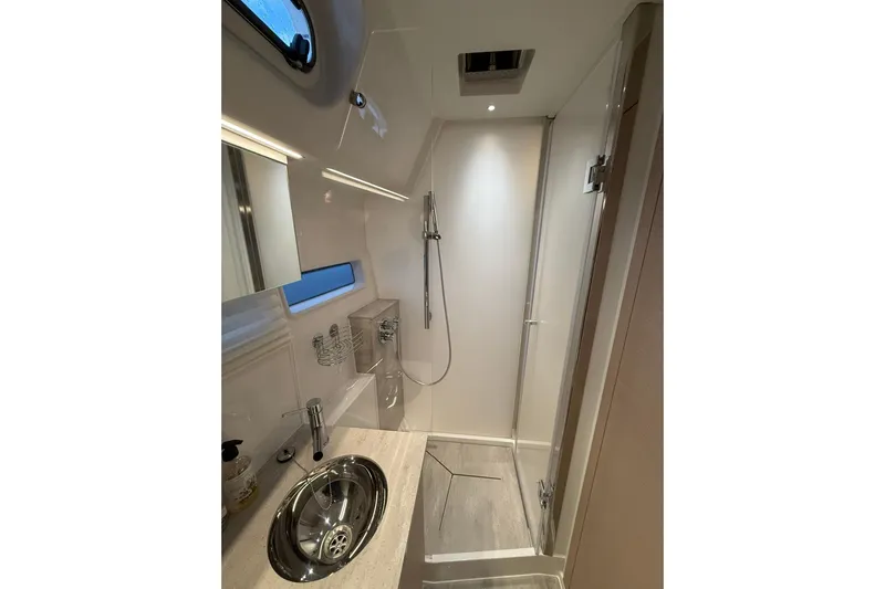 Gbtt Ex Lennartz Yacht Photos Pics Luxurious bathroom in 2025 Nimbus 495 Flybridge yacht with modern fixtures and shower.