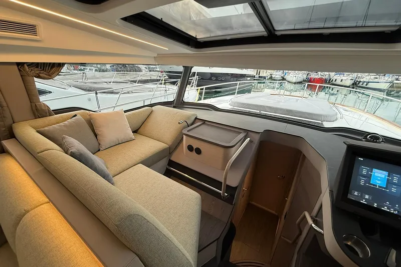 Gbtt Ex Lennartz Yacht Photos Pics Interior of 2025 Nimbus 495 Flybridge yacht with modern seating and navigation display.