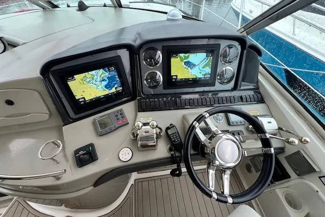 Dream Builder Yacht Photos Pics 2005 Sea Ray 420 Sundancer helm with dual navigation screens and modern controls.