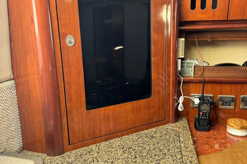 Dream Builder Yacht Photos Pics Interior of 2005 Sea Ray 420 Sundancer with wood cabinetry and communication equipment.