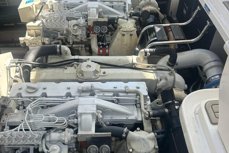 Dream Builder Yacht Photos Pics Engine room of a 2005 Sea Ray 420 Sundancer, showcasing dual marine engines.