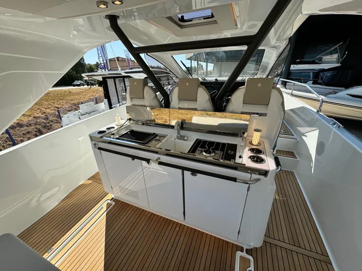  Yacht Photos Pics 2025 Jeanneau DB/37 IB yacht interior with modern kitchen and seating area.