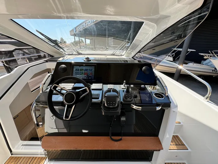  Yacht Photos Pics 2025 Jeanneau DB/37 IB boat cockpit with modern steering and navigation controls.