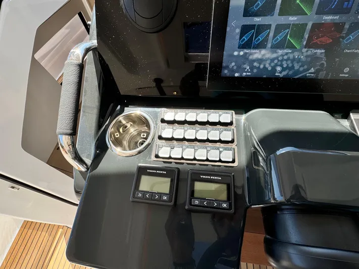  Yacht Photos Pics Control panel of 2025 Jeanneau DB/37 IB boat with touchscreen and Volvo Penta display.