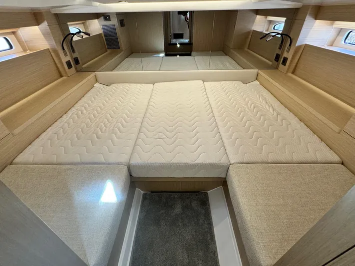  Yacht Photos Pics Luxurious cabin interior of 2025 Jeanneau DB/37 IB with spacious bed and modern design.