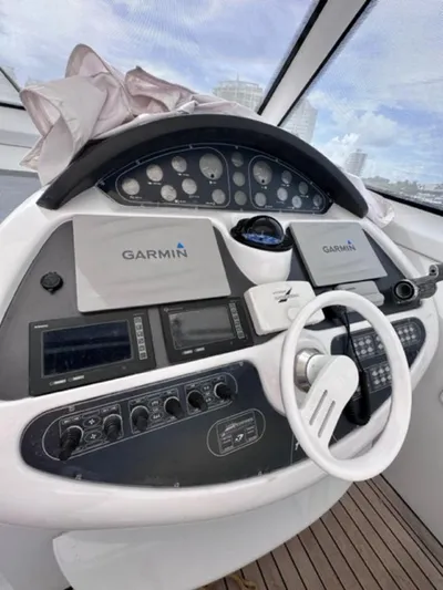 Kore Yacht Photos Pics 2006 Baia 63 Azzurra yacht helm with Garmin navigation systems.