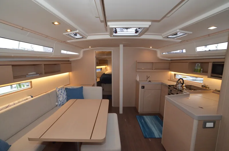 Marie Katherine Yacht Photos Pics Interior of 2022 Beneteau Oceanis 40.1 yacht, featuring modern kitchen and dining area.
