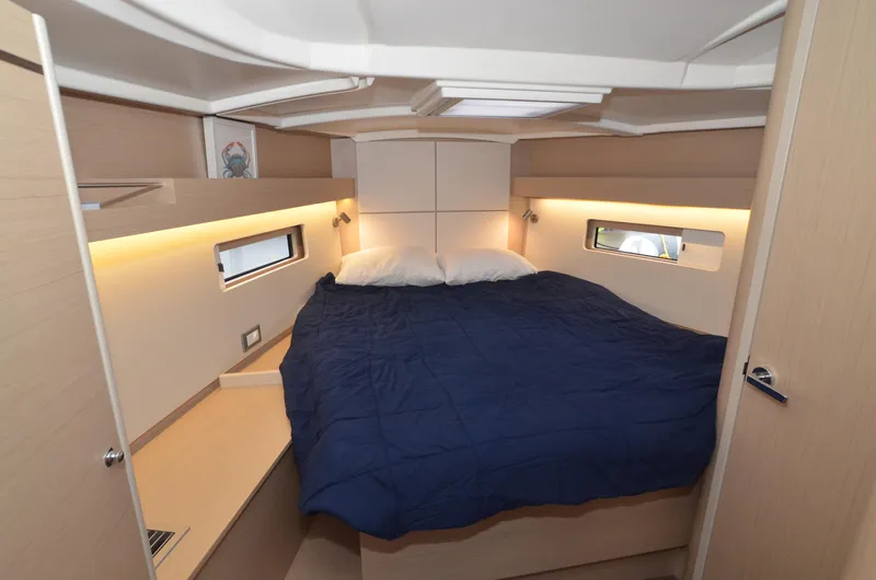 Marie Katherine Yacht Photos Pics Luxurious cabin interior of 2022 Beneteau Oceanis 40.1 yacht with cozy bedding.
