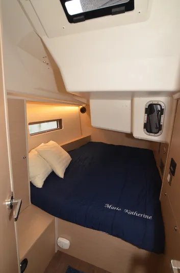Marie Katherine Yacht Photos Pics Cozy cabin interior of 2022 Beneteau Oceanis 40.1 yacht with blue bedding.