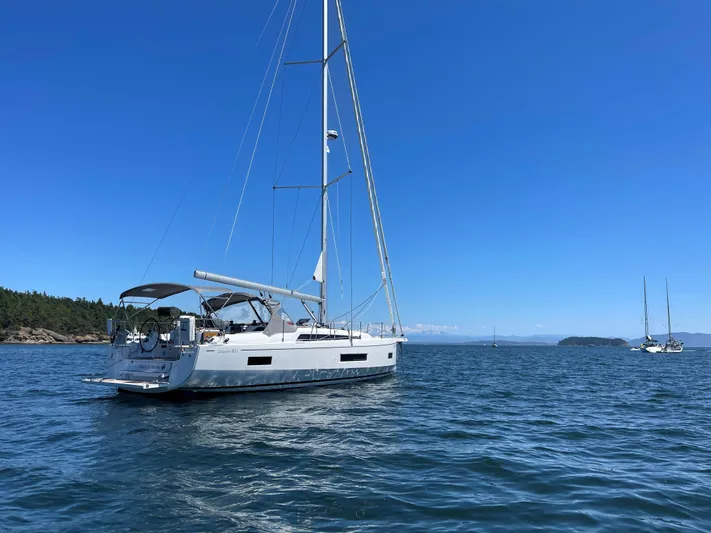 Marie Katherine Yacht Photos Pics 2022 Beneteau Oceanis 40.1 sailboat on calm blue waters under clear sky.