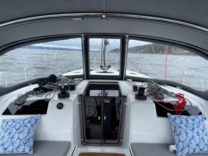 Marie Katherine Yacht Photos Pics Cockpit view of 2022 Beneteau Oceanis 40.1 sailboat with ocean backdrop.