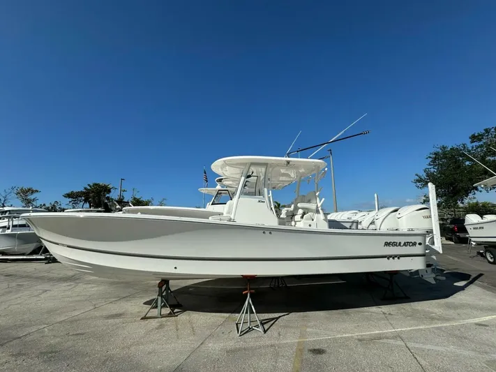  Yacht Photos Pics 2025 Regulator 30XO boat on display under clear blue sky.