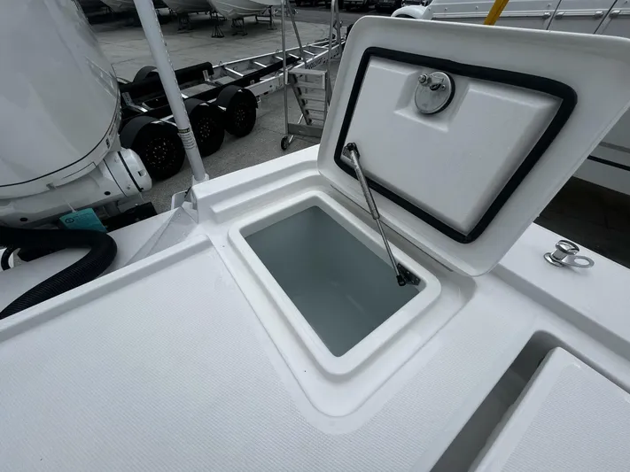  Yacht Photos Pics Open storage compartment on 2025 Regulator 30XO boat, showcasing interior space.