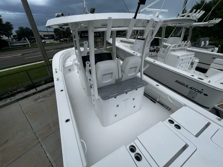  Yacht Photos Pics 2025 Regulator 30XO boat with sleek white design and spacious deck layout.