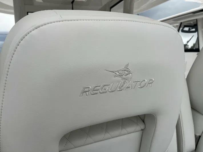  Yacht Photos Pics 2025 Regulator 30XO boat seat with embroidered logo, showcasing luxury marine craftsmanship.
