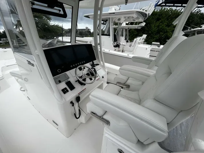 Yacht Photos Pics 2025 Regulator 30XO boat interior with modern helm and luxurious seating.
