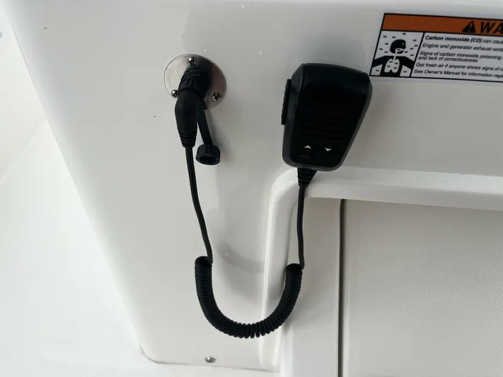  Yacht Photos Pics Microphone setup on 2025 Regulator 30XO boat with safety warning label.