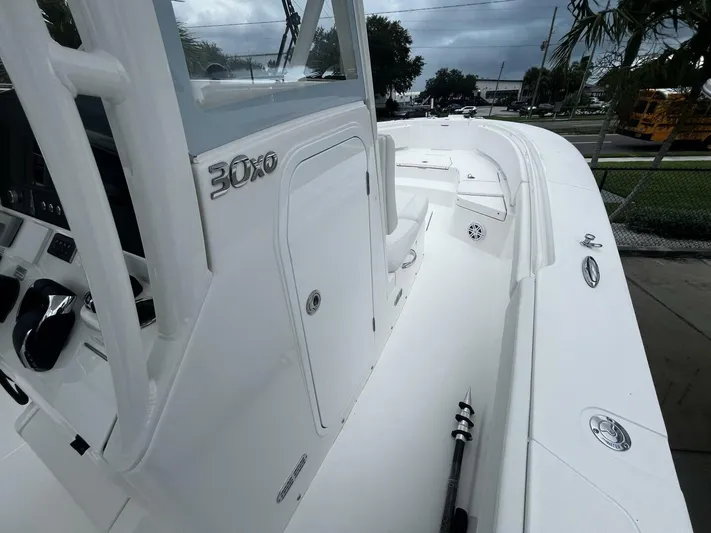  Yacht Photos Pics 2025 Regulator 30XO boat interior with sleek white design and modern controls.