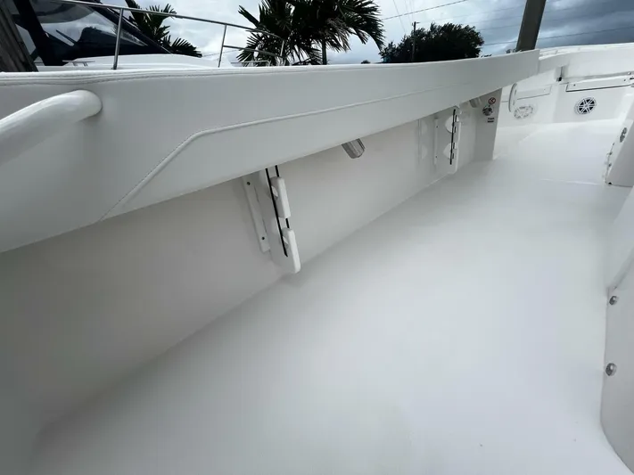 Yacht Photos Pics 2025 Regulator 30XO boat interior, showcasing sleek white deck and modern design elements.