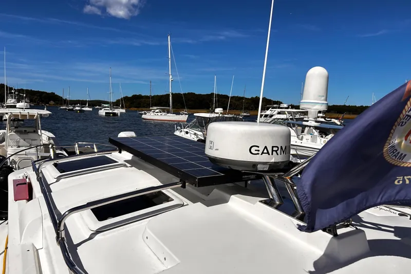  Yacht Photos Pics 2014 Cutwater C-28 boat with Garmin radar and solar panel, docked in a marina.